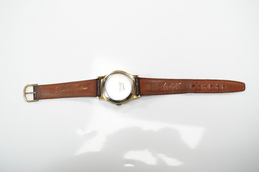 A gentleman's 1950's? steel and gold plated Oska Calendar Moonphase manual wind wrist watch, case diameter 32mm, on a later associated strap. Condition - poor to fair